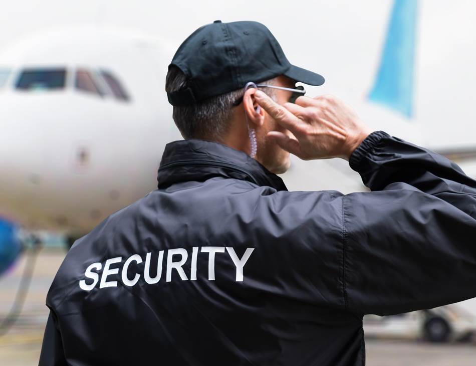 Security personnel using a DAMM communication system in an airport